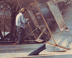 Hammond at work on the lid of the solar house's roof unit.